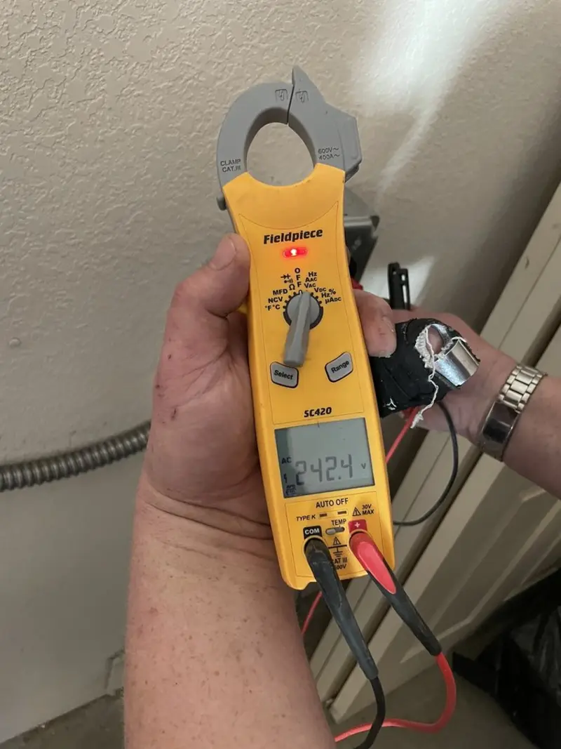 Voltage testing with clamp meter during Recessed Lighting Installation in Clarendon Hills